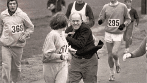 kathriine gets grabbed during Boston Marathon